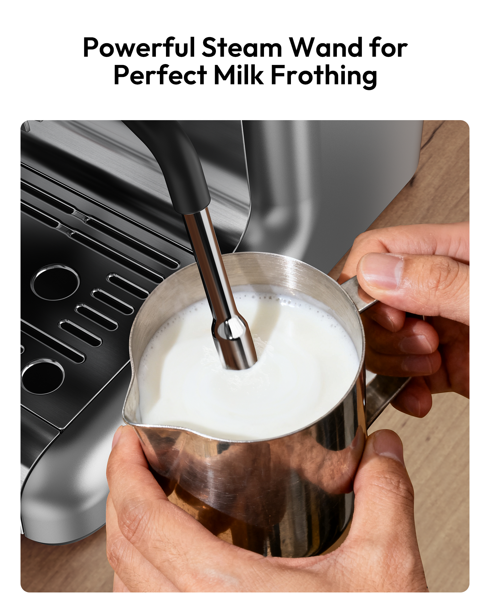 Espresso machine steam wand frothing milk in a stainless steel pitcher